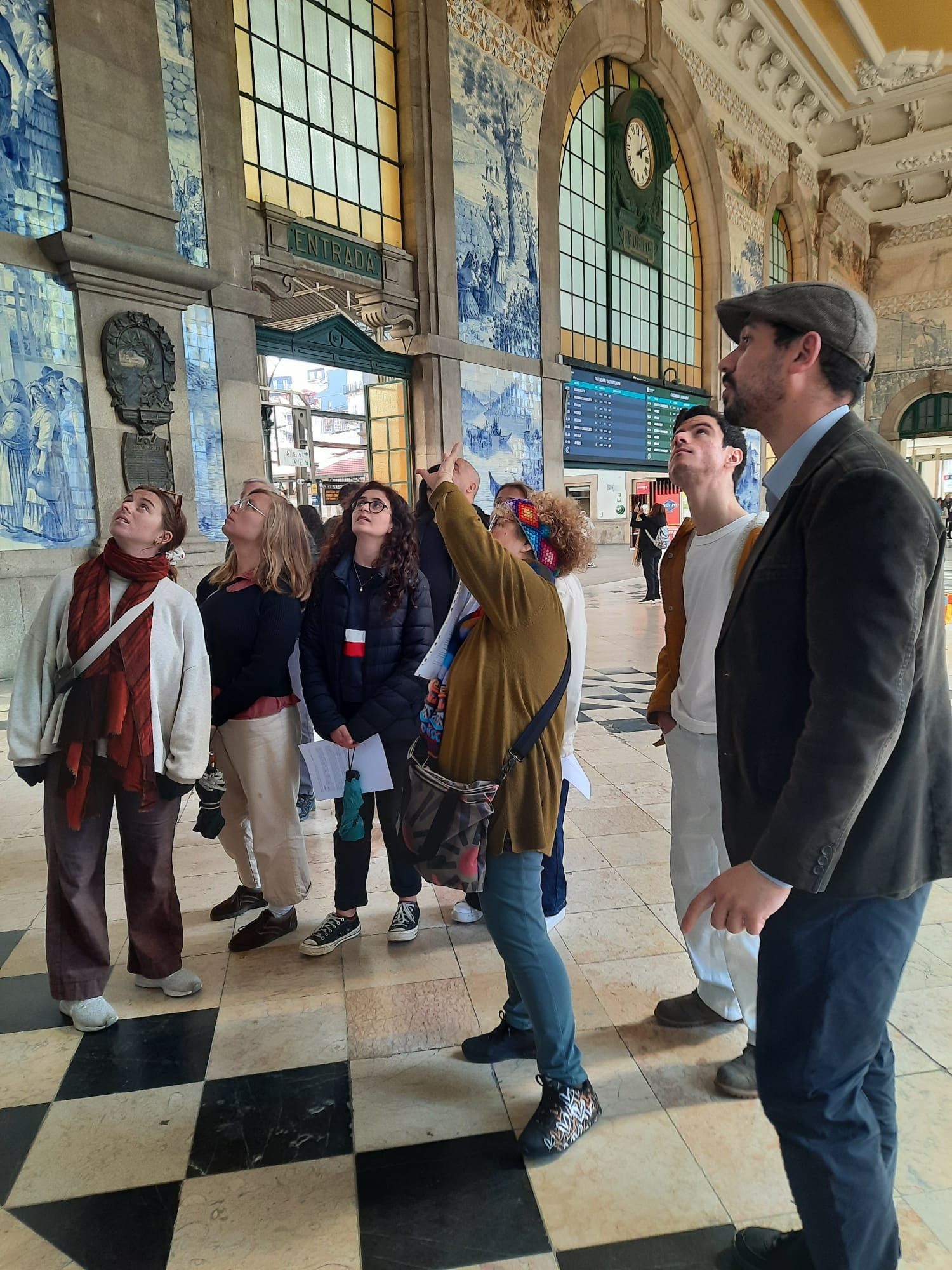 Tour group at São Bento station with guide